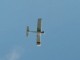 Model RC airplane performing a roll